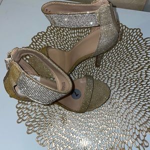 Gold sandal heels with silver Diamond around the band of strap